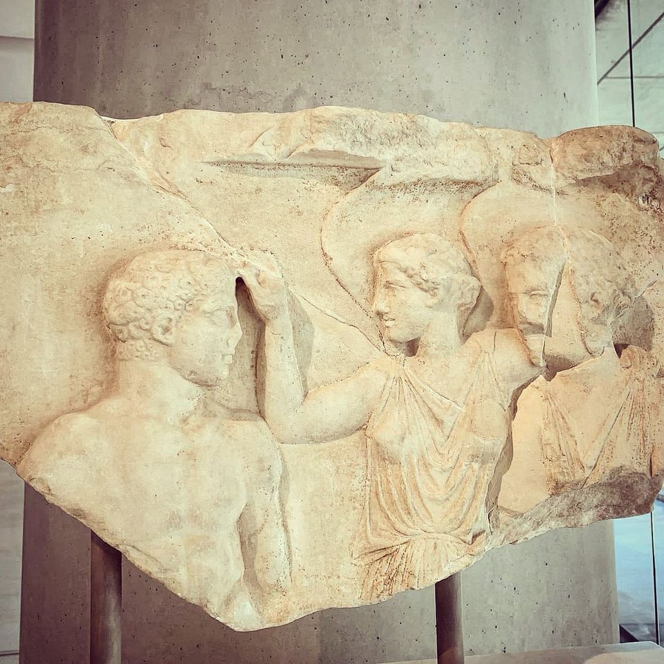 Relief showing Herakles crowned by Nike with Athena.